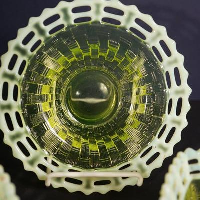 Sale Photo Thumbnail #31: At auction is a grouping of three Fenton candy dishes in the basket weave pattern, 
Lacy edge of opalescent glass. 
Mold blown 
early 1930's 
Uranium content glows under UV light 

round bowl measures: 7" across the top 
Height : 1 3/4" 
condition; very g
