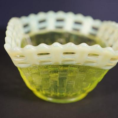 Sale Photo Thumbnail #34: At auction is a grouping of three Fenton candy dishes in the basket weave pattern, 
Lacy edge of opalescent glass. 
Mold blown 
early 1930's 
Uranium content glows under UV light 

round bowl measures: 7" across the top 
Height : 1 3/4" 
condition; very g