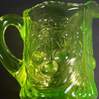 Sale Photo Thumbnail #46: creamer of 4 1/2" to 4 3/4" two mold glass of vaseline glass color UV light fluorescent 
the color is the light green vaseline color and perhaps should be more of a yellow color for this pattern
I question that it is a reproduction from the 60's or ?