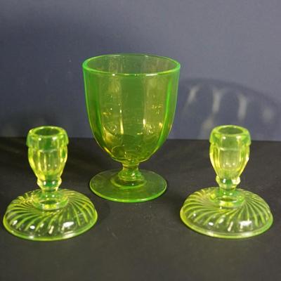 Sale Photo Thumbnail #49: 1930's vaseline glass footed candy dish, no lid. The  rim  has rounded edge so maybe did not have a lid orginal just over 5" and in good condition 
the candleholders are 4" in height, good condition 
UV light fluorescent