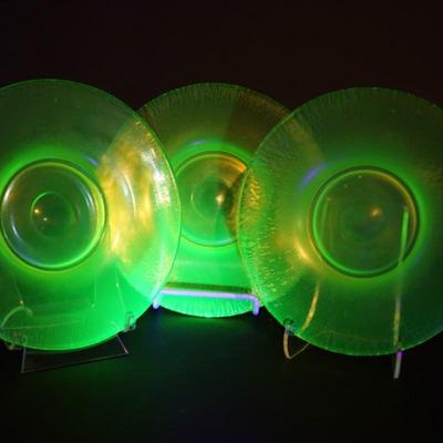 Sale Photo Thumbnail #64: group of 3 8" vaseline glass stretch glass plates. The have the look of favrille glass, multi color in the right light, 
UV light fluorescent
condition: no chips or cracks. the centers may need additional cleaning as slighty foggy. please see photo.