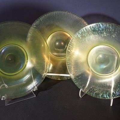 Sale Photo Thumbnail #63: group of 3 8" vaseline glass stretch glass plates. The have the look of favrille glass, multi color in the right light, 
UV light fluorescent
condition: no chips or cracks. the centers may need additional cleaning as slighty foggy. please see photo.