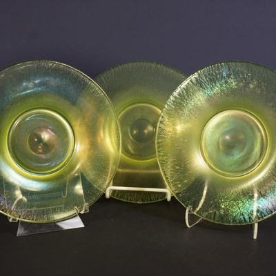 Sale Photo Thumbnail #59: group of 3 8" vaseline glass stretch glass plates. The have the look of favrille glass, multi color in the right light, 
UV light fluorescent
condition: no chips or cracks. the centers may need additional cleaning as slighty foggy. please see photo.