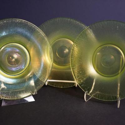 Sale Photo Thumbnail #58: group of 3 8" vaseline glass stretch glass plates. The have the look of favrille glass, multi color in the right light, 
UV light fluorescent
condition: no chips or cracks. the centers may need additional cleaning as slighty foggy. please see photo.