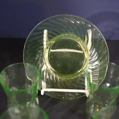 Sale Photo Thumbnail #68: vaseline pinch glass pattern juice glasses four. in good condition
6" swirl pattern  vaseline glass plate 
UV light tested - fluorescent 
good condition no damage noted.