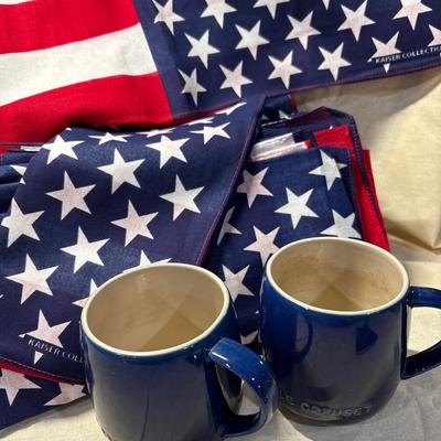 Patriotic napkins and two le Creuset mugs.