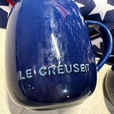 Patriotic napkins and two le Creuset mugs.
