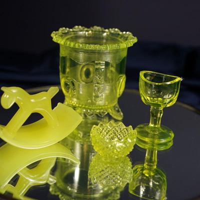 Sale Photo Thumbnail #77: pattern glass sugar dish 3 1/2" is missing lid and has a stress crack not all the way through inside
The rocking horse has a chip off one of the ears  height 2 1/2"
the eye cup and salter are in good condition