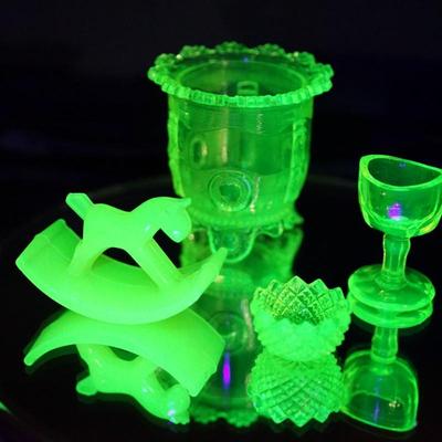 Sale Photo Thumbnail #81: pattern glass sugar dish 3 1/2" is missing lid and has a stress crack not all the way through inside
The rocking horse has a chip off one of the ears  height 2 1/2"
the eye cup and salter are in good condition