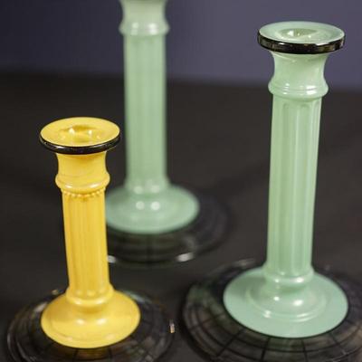 Sale Photo Thumbnail #86: satin glass with clear base with webb pattern of black . 
2 sage color at 8 1/4" and a mustard color satin finish at 6" 
sage pair are in very good condition
6" mustard colored one is cracked where the candle sits. interior crack that does not go all the 