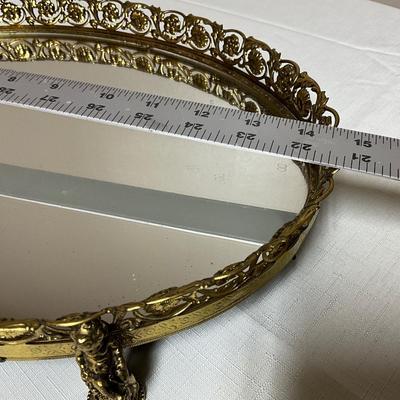 Sale Photo Thumbnail #179: Gold-tone metal filigree vanity tray with cherub feet
Fabulous shape