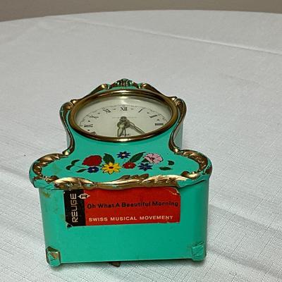 Sale Photo Thumbnail #187: Swiss movement and hand-painted floral details.