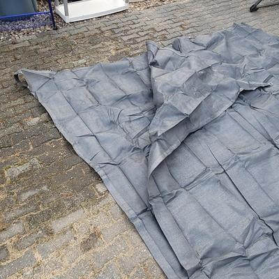 Sale Photo Thumbnail #1008: This is a grey, breathable camping groundsheet or awning carpet. 
It is made from a durable, non-perishable woven material that allows air and moisture to pass through. 
The tight weave acts as an effective barrier to insects and worms while protecting th