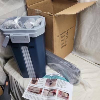 Sale Photo Thumbnail #1042: This is a flat mop and bucket set with the following features:
Features a dual-chambered bucket that separates clean and dirty water. 
The mop head has a flexible 360-degree swivel head for hard-to-reach places. 
Includes reusable, machine-washable microf