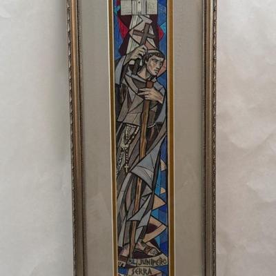 Tall, Slender framed art Monk holding a cross with Mission in background