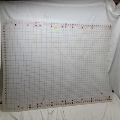 Sale Photo Thumbnail #1160: Sullivans self-healing craft cutting mat. 
It is designed for sewing, quilting, and crafting projects. 
The mat has a 1-inch grid layout with numbers placed on the outside of the grid to prevent them from being cut off.