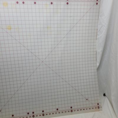 Sale Photo Thumbnail #1162: Sullivans self-healing craft cutting mat. 
It is designed for sewing, quilting, and crafting projects. 
The mat has a 1-inch grid layout with numbers placed on the outside of the grid to prevent them from being cut off.