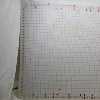 Sale Photo Thumbnail #1161: Sullivans self-healing craft cutting mat. 
It is designed for sewing, quilting, and crafting projects. 
The mat has a 1-inch grid layout with numbers placed on the outside of the grid to prevent them from being cut off.