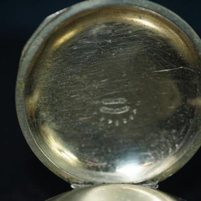 Sale Photo Thumbnail #113: antique open face pocket watch
Works : 389164
key wind- key is missing 
Hampden
case:7926 
beveled crystal has scratches, case has small dent on the back. there is a small area of discoloration indents on the back also see photo
one of the  minute hand of