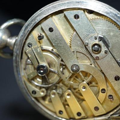 Sale Photo Thumbnail #127: antique pocket watch. silverplated /case coin? 
Case: 52810
no markings found inside the works, 
bezel and crystal intact and in good condition 
key wind- key is missing, 
The watch is selling as is. Not working 
engraved case of trees and cottage on one 