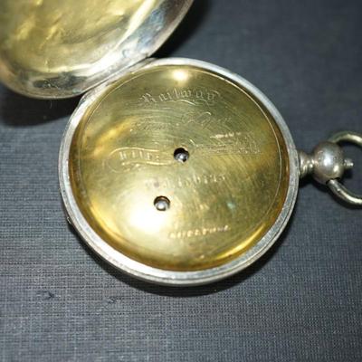 Sale Photo Thumbnail #125: antique pocket watch. silverplated /case coin? 
Case: 52810
no markings found inside the works, 
bezel and crystal intact and in good condition 
key wind- key is missing, 
The watch is selling as is. Not working 
engraved case of trees and cottage on one 