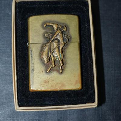 Sale Photo Thumbnail #146: 1994 marlboro zippo lighter brass, In original box with papers. 
The outside has wear and the brass is discolored in areas on the front and back. This could be cleaned but some prefer not to restore the finish, There are no dents or damage to the case. th