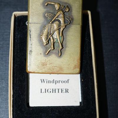 Sale Photo Thumbnail #143: 1994 marlboro zippo lighter brass, In original box with papers. 
The outside has wear and the brass is discolored in areas on the front and back. This could be cleaned but some prefer not to restore the finish, There are no dents or damage to the case. th