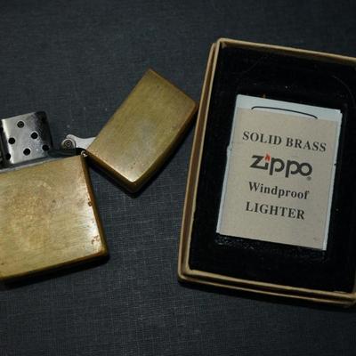 Sale Photo Thumbnail #145: 1994 marlboro zippo lighter brass, In original box with papers. 
The outside has wear and the brass is discolored in areas on the front and back. This could be cleaned but some prefer not to restore the finish, There are no dents or damage to the case. th