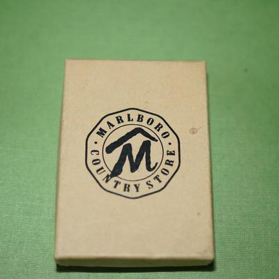 Sale Photo Thumbnail #147: 1994 marlboro zippo lighter brass, In original box with papers. 
The outside has wear and the brass is discolored in areas on the front and back. This could be cleaned but some prefer not to restore the finish, There are no dents or damage to the case. th