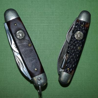 Sale Photo Thumbnail #148: two boyscout pocket knives. One is an Imperial the other is an Ulster,
One is a bone handle the other is a wood handle with a ridged finish,
See photos of the blades displayed open
the blades and metal are soiled and need cleaning, the collector has their