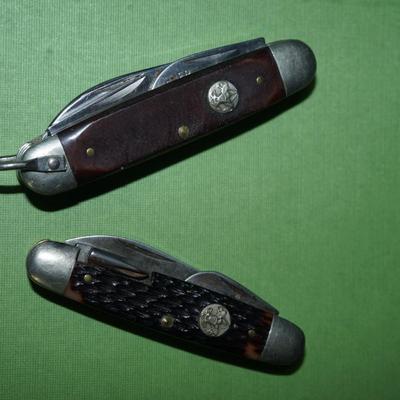 Sale Photo Thumbnail #149: two boyscout pocket knives. One is an Imperial the other is an Ulster,
One is a bone handle the other is a wood handle with a ridged finish,
See photos of the blades displayed open
the blades and metal are soiled and need cleaning, the collector has their