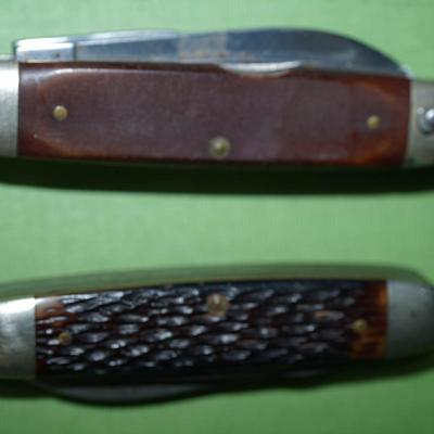 Sale Photo Thumbnail #152: two boyscout pocket knives. One is an Imperial the other is an Ulster,
One is a bone handle the other is a wood handle with a ridged finish,
See photos of the blades displayed open
the blades and metal are soiled and need cleaning, the collector has their