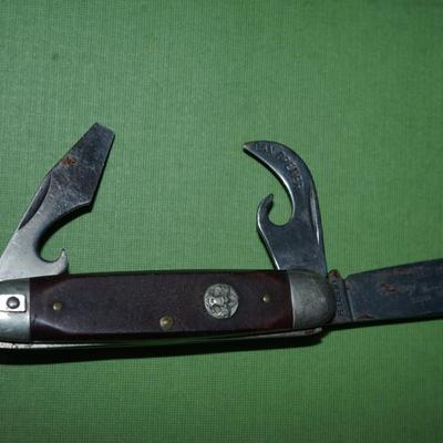 Sale Photo Thumbnail #155: two boyscout pocket knives. One is an Imperial the other is an Ulster,
One is a bone handle the other is a wood handle with a ridged finish,
See photos of the blades displayed open
the blades and metal are soiled and need cleaning, the collector has their