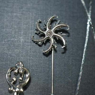 Sale Photo Thumbnail #159: Grouping of 6 jewelry items stamped sterling. 
The weight (without the sterling framed lapis pendant by Verna Craig ) is 20 grams. I didnt include the pendant because of the stone setting 
The chains  on two of them are sterling but not the Verna Craig ne