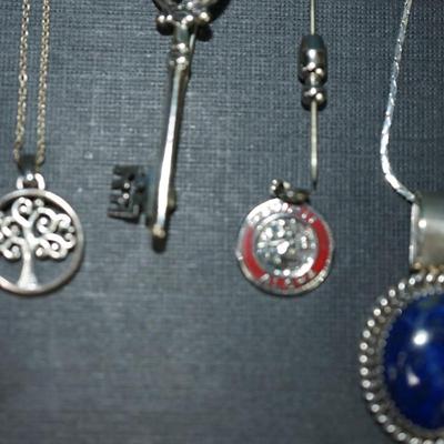 Sale Photo Thumbnail #157: Grouping of 6 jewelry items stamped sterling. 
The weight (without the sterling framed lapis pendant by Verna Craig ) is 20 grams. I didnt include the pendant because of the stone setting 
The chains  on two of them are sterling but not the Verna Craig ne