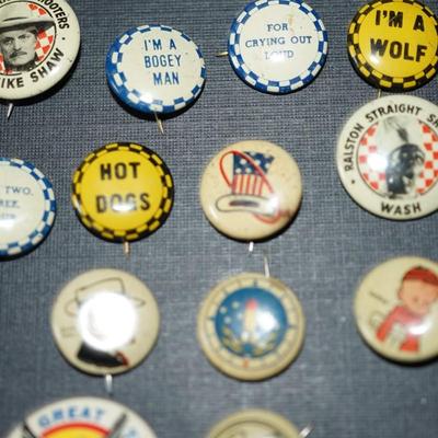 Sale Photo Thumbnail #172: vintage cereal box pins and other. 1940's and up. 
Roy Rogers and Mike Shaw pins included
20 in all . They measures from 1/2" to 1" round, 
condition is good for the age. Some slight wear and discoloration to a few