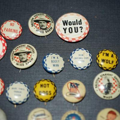Sale Photo Thumbnail #173: vintage cereal box pins and other. 1940's and up. 
Roy Rogers and Mike Shaw pins included
20 in all . They measures from 1/2" to 1" round, 
condition is good for the age. Some slight wear and discoloration to a few