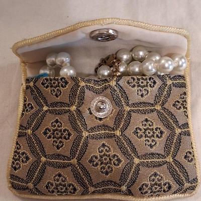 Sale Photo Thumbnail #114: Necklace is marked on clasp as pictured. I believe these are hand knotted cultured white pearls. I can not say for sure. They pass all the home tests but I have not taken them to a jeweler. 

Comes complete with its own keepsake bag. Is supposed to help r