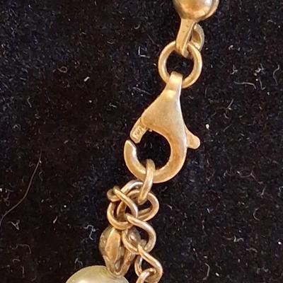Sale Photo Thumbnail #117: Necklace is marked on clasp as pictured. I believe these are hand knotted cultured white pearls. I can not say for sure. They pass all the home tests but I have not taken them to a jeweler. 

Comes complete with its own keepsake bag. Is supposed to help r