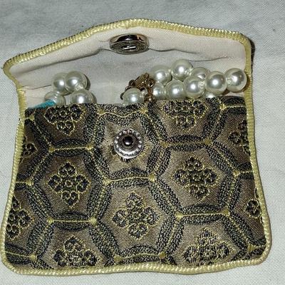 Sale Photo Thumbnail #115: Necklace is marked on clasp as pictured. I believe these are hand knotted cultured white pearls. I can not say for sure. They pass all the home tests but I have not taken them to a jeweler. 

Comes complete with its own keepsake bag. Is supposed to help r