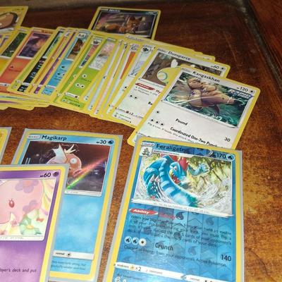 Sale Photo Thumbnail #178: 50 Random Cards. May include Holos, Japanese,  Rares, Commons & more
Sleeves shown are included.