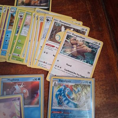 Sale Photo Thumbnail #180: 50 Random Cards. May include Holos, Japanese,  Rares, Commons & more
Sleeves shown are included.