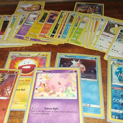 Sale Photo Thumbnail #171: 50 Random Cards. May include Holos, Japanese,  Rares, Commons & more
Sleeves shown are included.