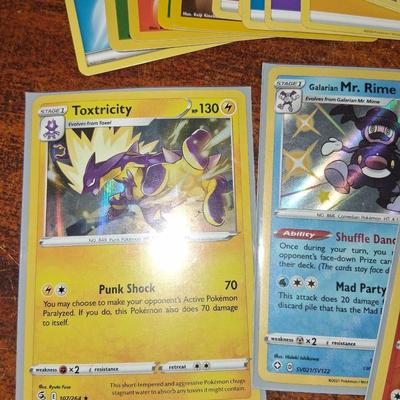 Sale Photo Thumbnail #174: 50 Random Cards. May include Holos, Japanese,  Rares, Commons & more
Sleeves shown are included.