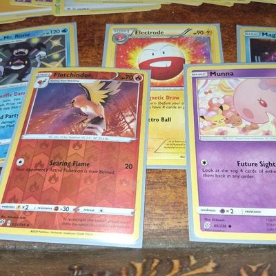 Sale Photo Thumbnail #169: 50 Random Cards. May include Holos, Japanese,  Rares, Commons & more
Sleeves shown are included.