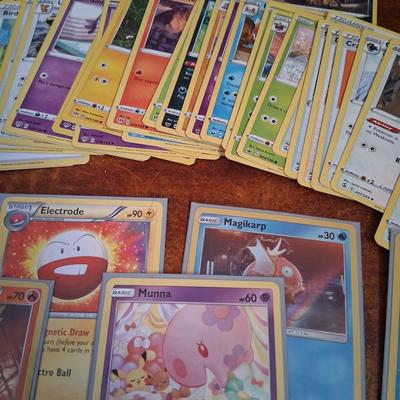Sale Photo Thumbnail #179: 50 Random Cards. May include Holos, Japanese,  Rares, Commons & more
Sleeves shown are included.