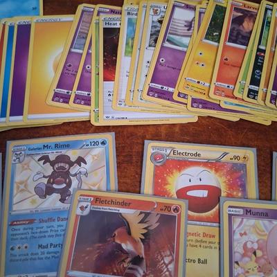 Sale Photo Thumbnail #168: 50 Random Cards. May include Holos, Japanese,  Rares, Commons & more
Sleeves shown are included.