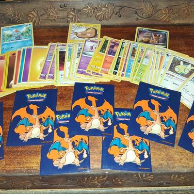 Sale Photo Thumbnail #181: 50 Random Cards. May include Holos, Japanese,  Rares, Commons & more
Sleeves shown are included.