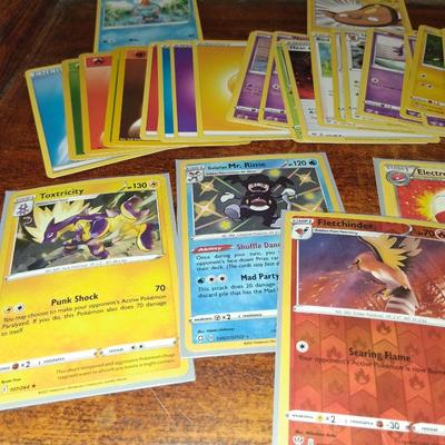 Sale Photo Thumbnail #170: 50 Random Cards. May include Holos, Japanese,  Rares, Commons & more
Sleeves shown are included.