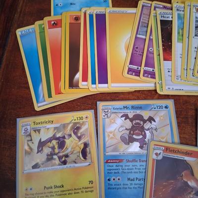 Sale Photo Thumbnail #177: 50 Random Cards. May include Holos, Japanese,  Rares, Commons & more
Sleeves shown are included.